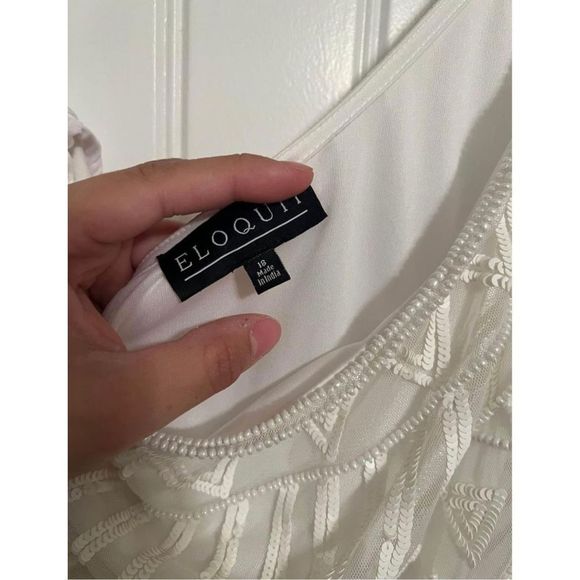 One shoulder white jumpsuit from Eloquii.
Size 18
Beaded detail on top.
Purchase - Picture 7 of 11
